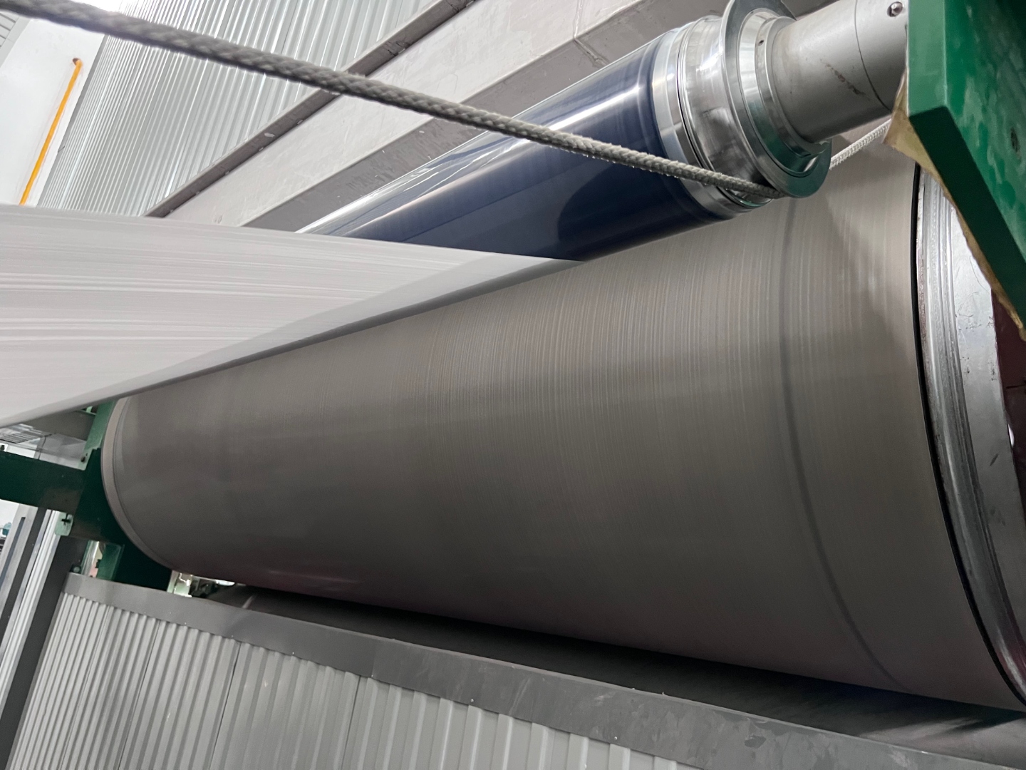 AEGIS low friction PTFE coated roller in operation, smooth release surface engineered for low coefficient of friction