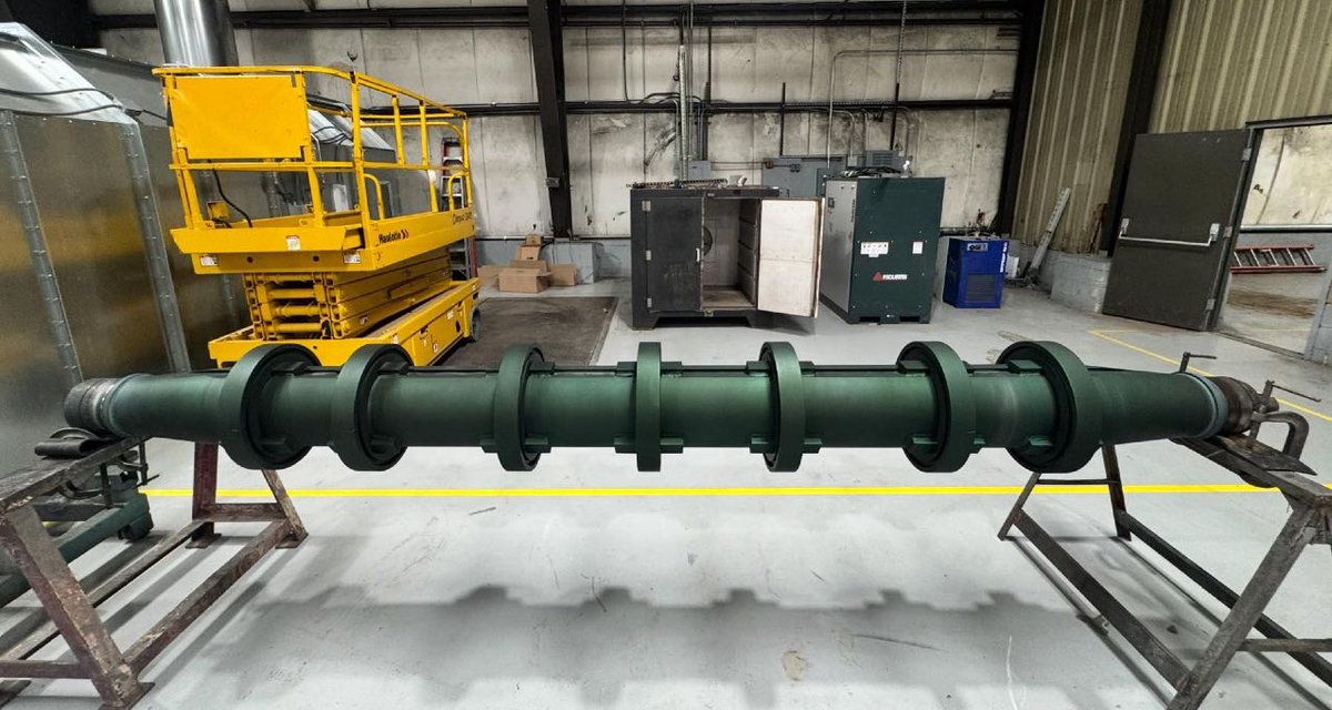 Completed coated screw conveyor with tungsten carbide and corrosion coating overlay